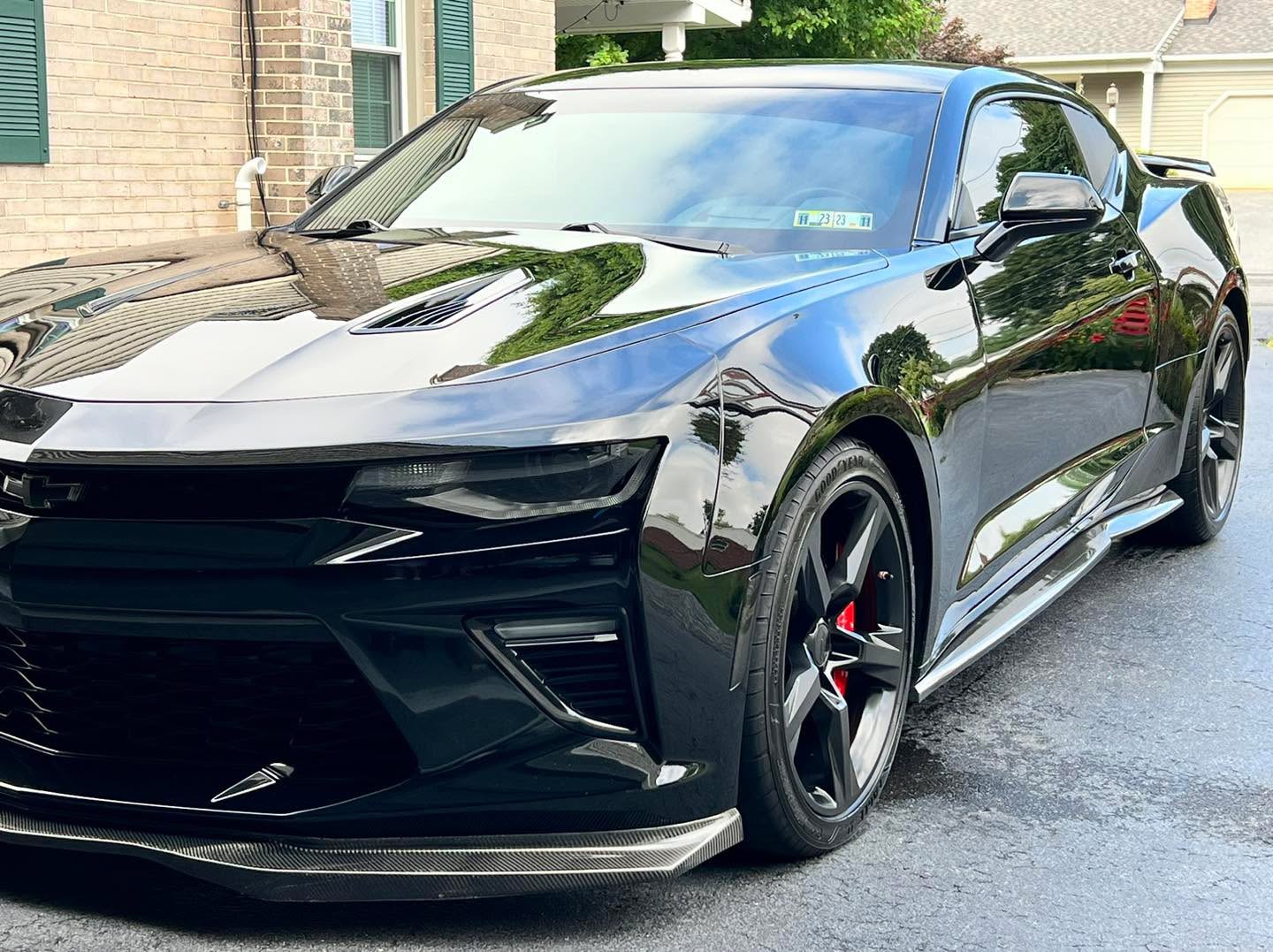 Black Chevrolet Camaro SS showing mirror-finish paint depth after correction at Attention 2 Details Lancaster PA