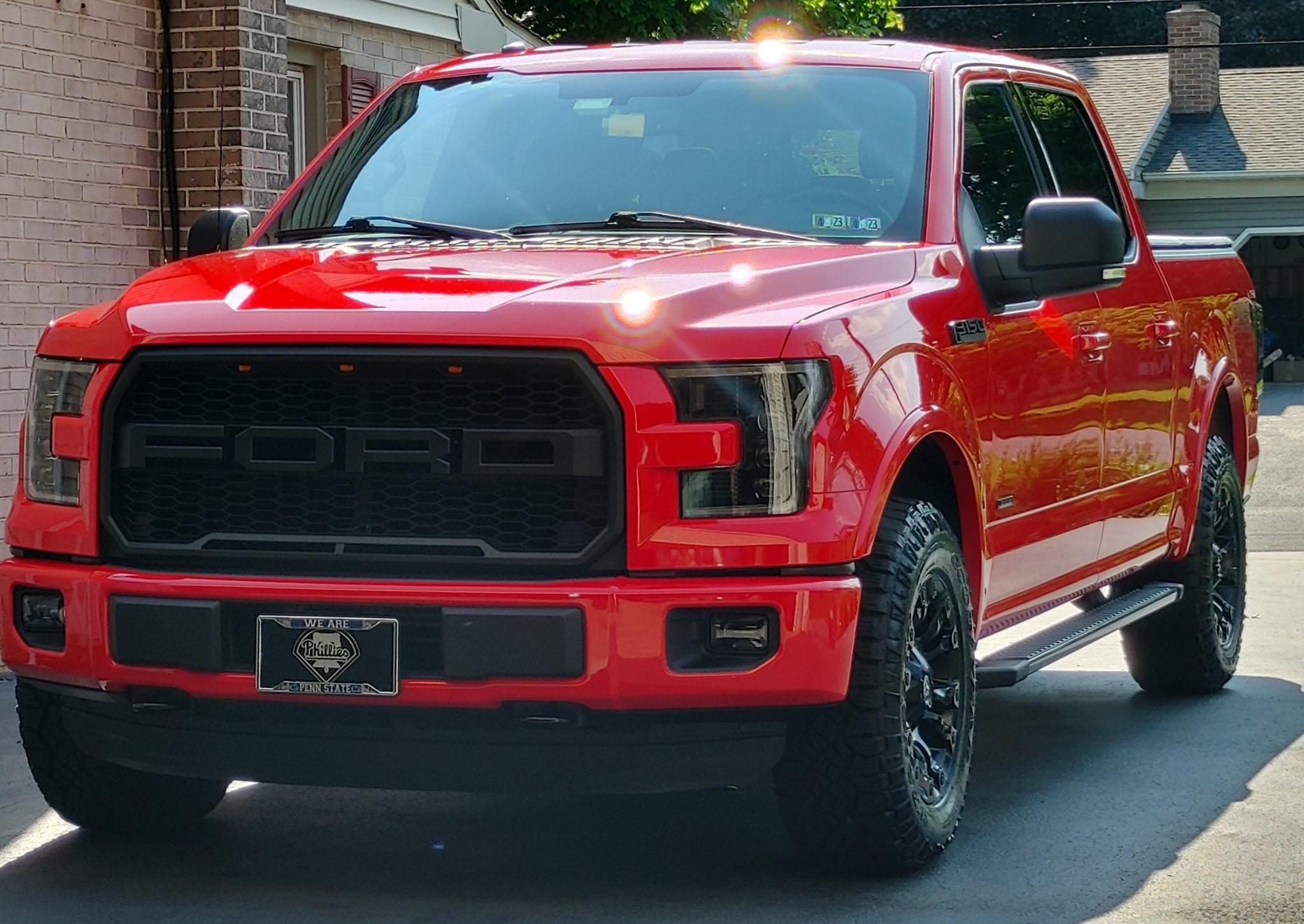 Red Ford F-150 with stunning paint correction and sun flare at Attention 2 Details Lancaster PA